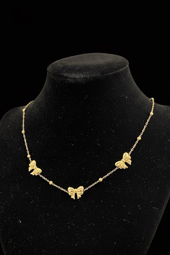 Gold bow necklace ￼